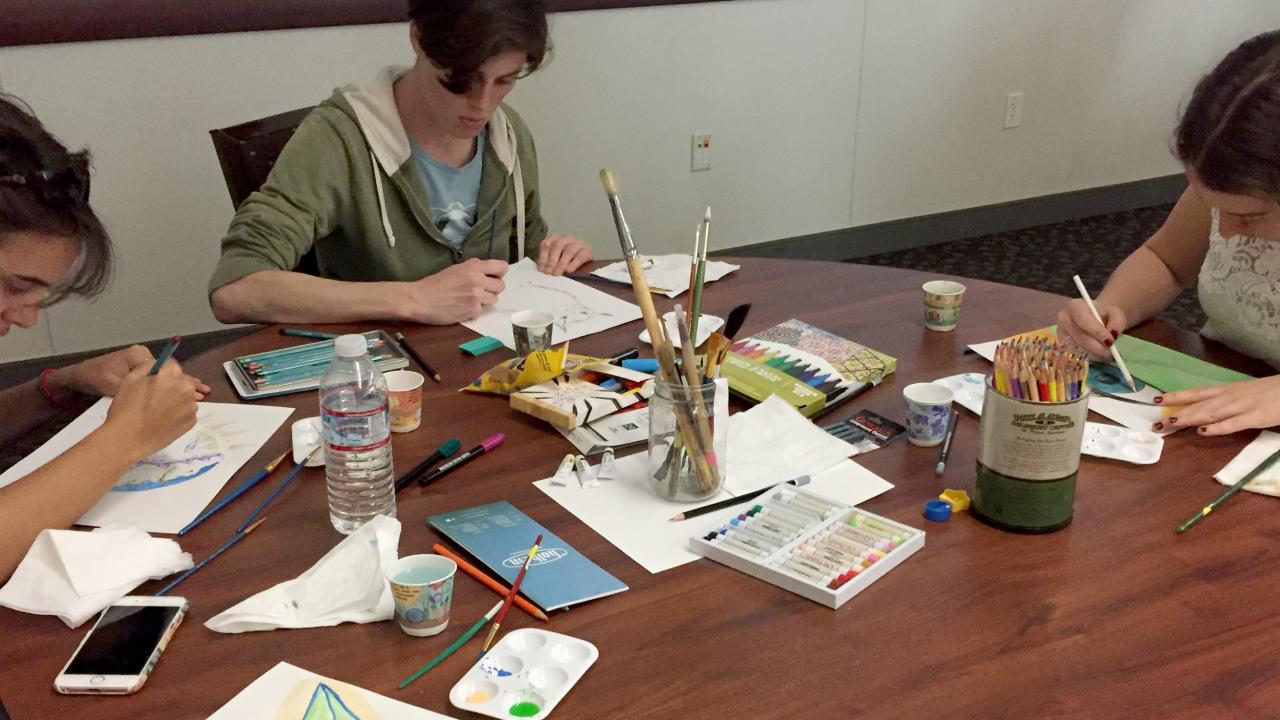 Graduate students at an art therapy workshop hosted by PFTF