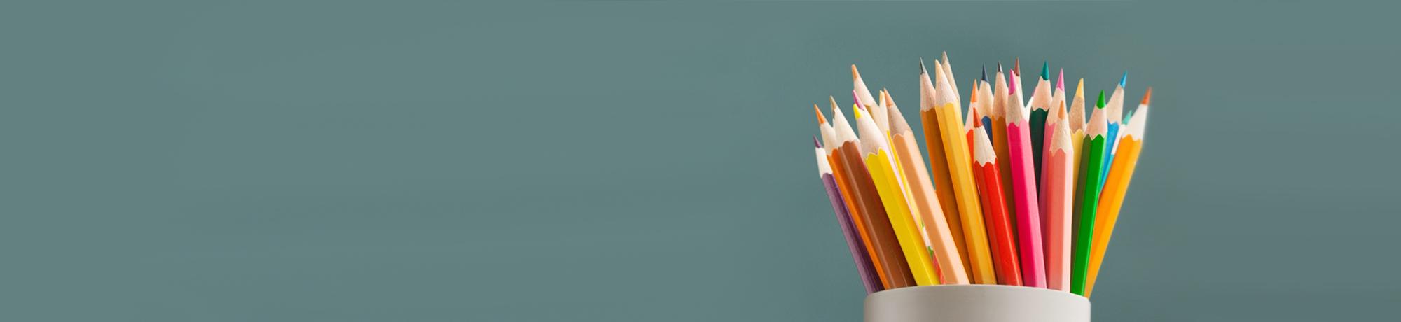 pencils and green blackboard